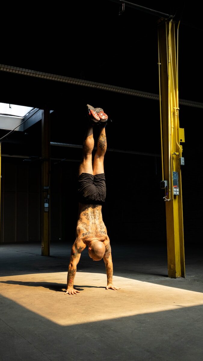 a person doing a handstand on a dog